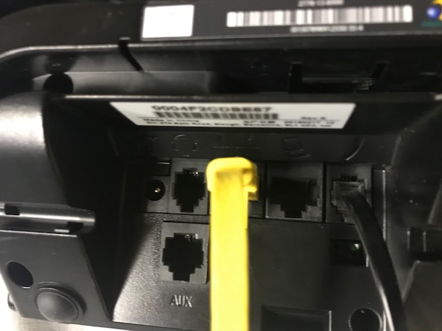 Plug the yellow cable into the phone